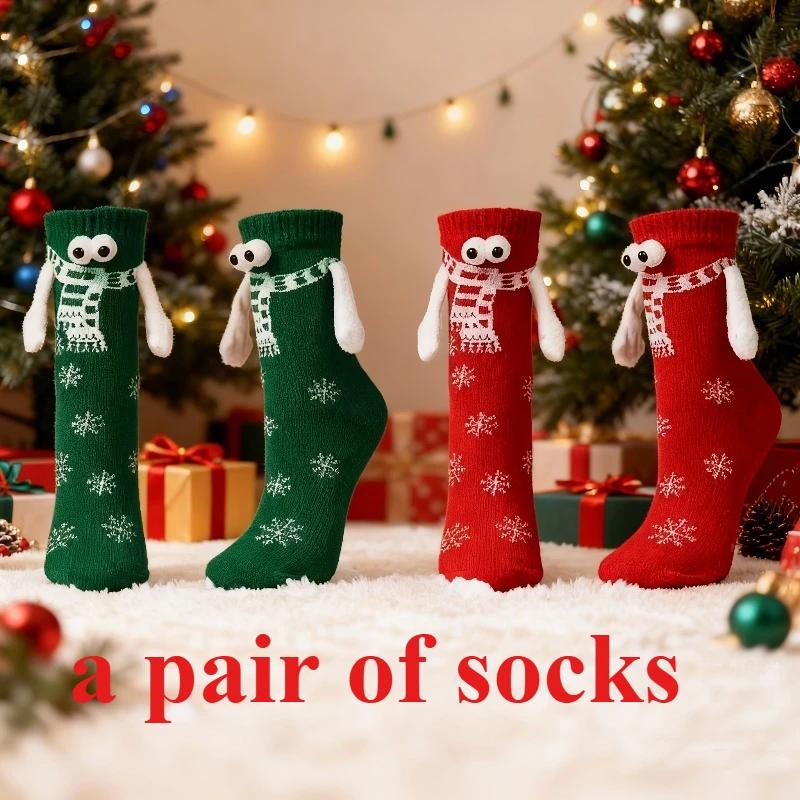 A pair of socks Fabric Christmas Socks - 3D Eyes Magnetic Cartoon Design, Hand-in-Hand Mid-Calf Playful Holiday Gift