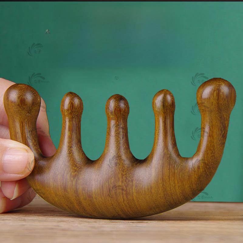 One Piece Gold Sandalwood Five-Tooth Massage Comb for Head and Meridian Stimulation.