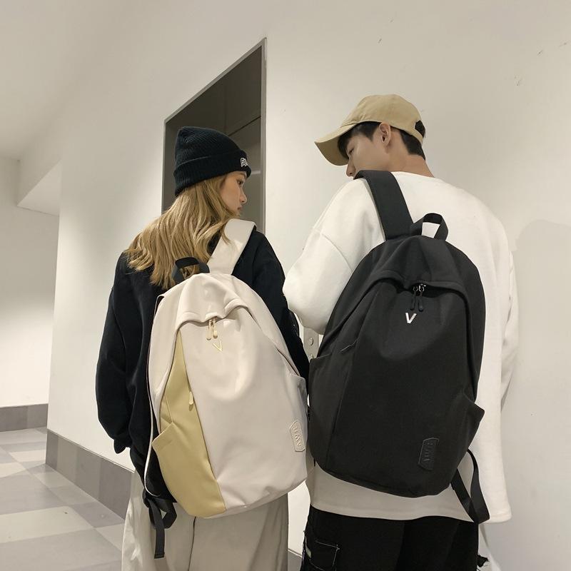 A Male College Student with A Small Simple Large-capacity Computer Backpack