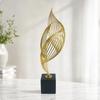 Gold-Tone Metal Sculpture with Black Marble Base Modern Sculptural Accent