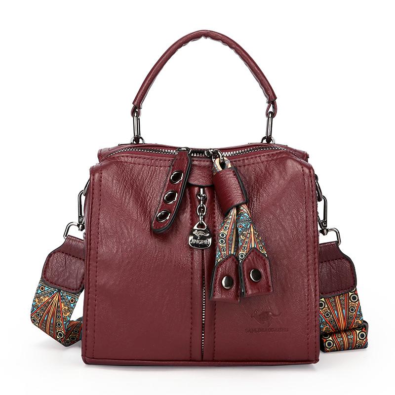 

Це висококласна жіноча сумочка, сумка на одне плече для поїздок на роботу та багатошарова кросбоді-сумка великої місткості. червоний