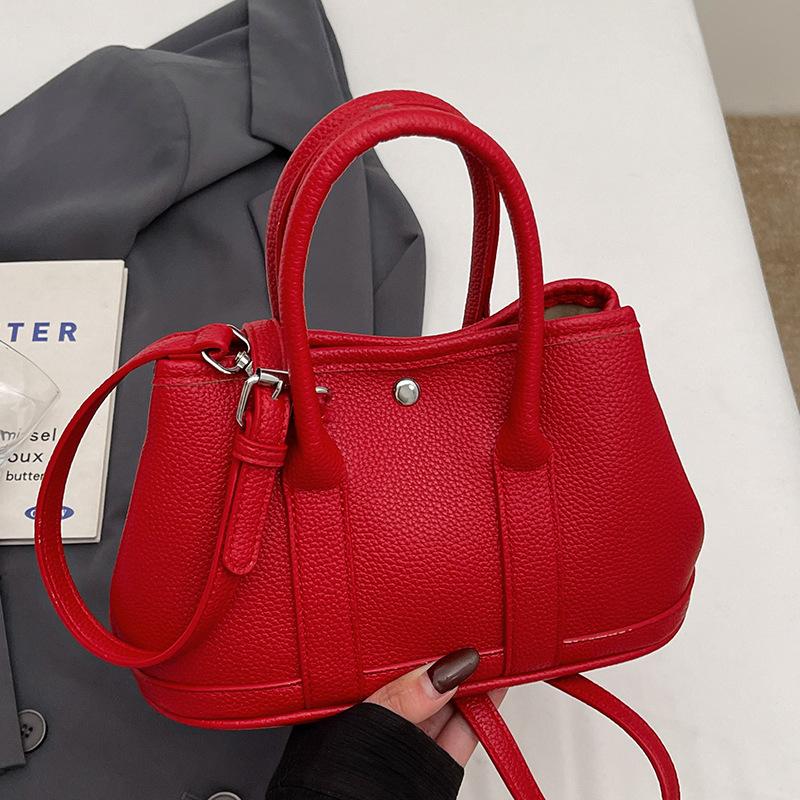 

2025 Корейская новая нишевая простая повседневная сумка-ведро для поездок на работу, портативная, универсальный дизайн, однотонная сумка-мессенджер для женщин