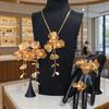 Exquisite 4-Piece Tassel Jewelry Set: Hollow Flower Necklace, Earrings, Bracelet & Ring