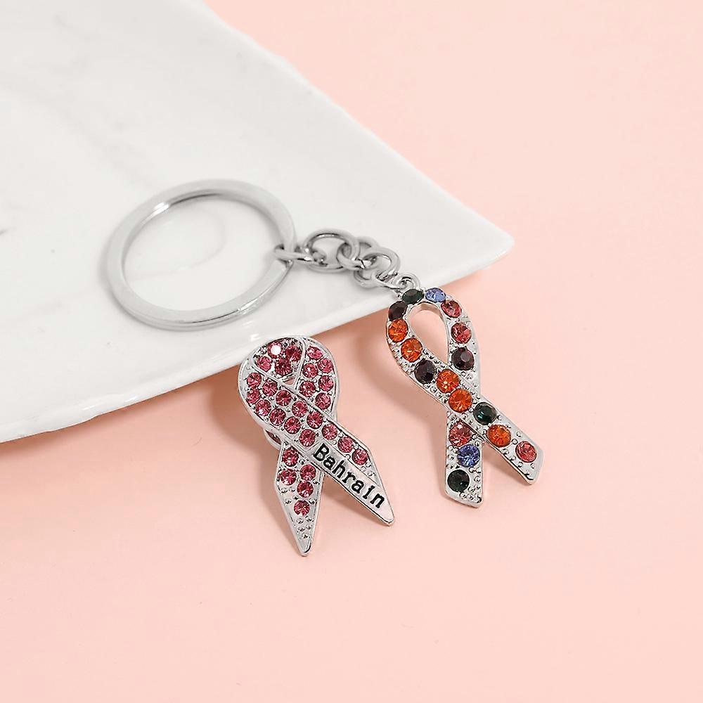 Creative and unique pink ribbon brooch keychain alloy drip pendant D1282
