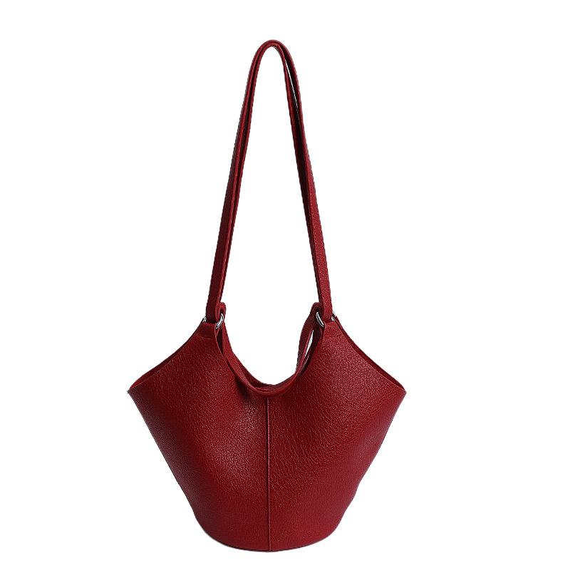 Niche high-end soft leather vegetable basket hand carrying bucket bag women's new commuter shoulder armpit bag