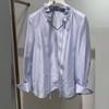 In Stock: 2026 Spring Fashion Sky Blue Lace-up Ruffle V-neck Women's Shirt 1H3120101G