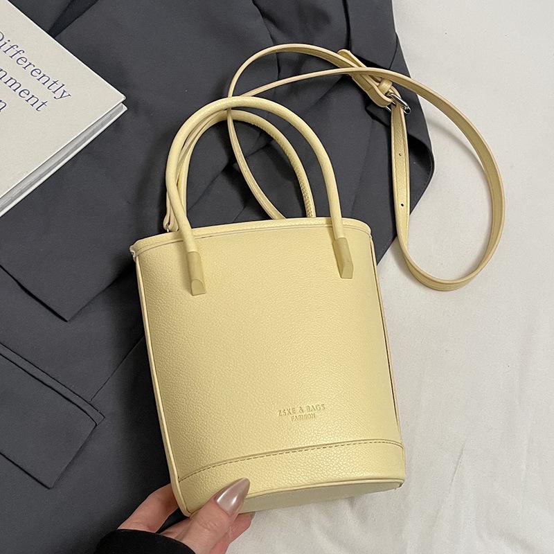 Wholesale New Products Niche Simple Solid Color Lychee Pattern Texture Hand Carry Bucket Bag Versatile Foreign Style Commuting Messenger Women's Bag