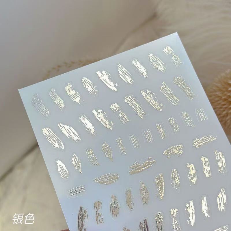 

Зеркальный глянцевый стикер для ногтей с нерегулярным узором, золотым тиснением, текстурой жидкого металла и клейкой основой T192-Bronzing Sticker, Silver