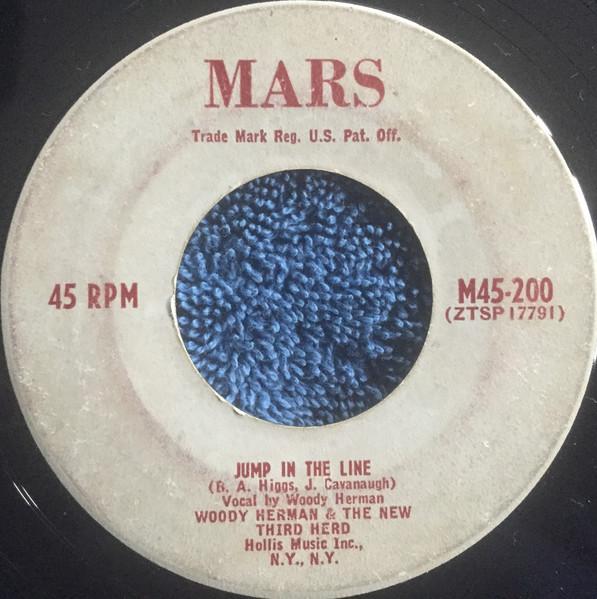 

7-дюймовая пластинка WOODY HERMAN HIS THIRD HERD Jump In The Line M45200 Март 1952 США Джаз Б/у