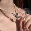 Vivienne Westwood Saturn Pearl Necklace: Women's Luxury Choker with Vivienne's Planet Clavicle Chain