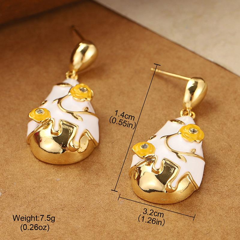 Water drop engraved earrings women s summer versatile personalized stud earrings exaggerated retro niche high-end design fringed earrings
