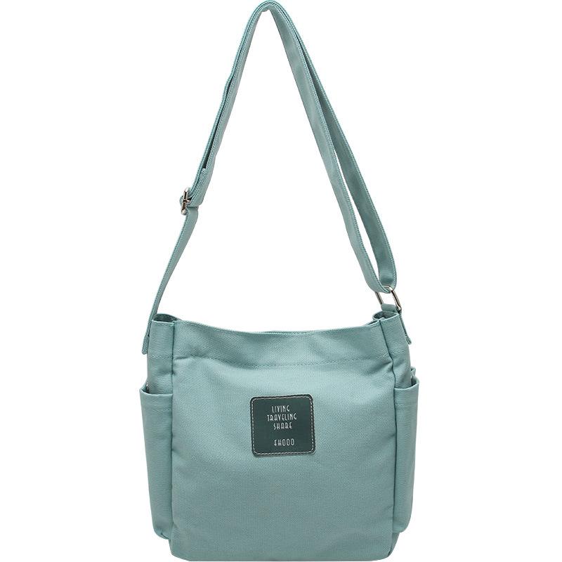 

2025 spring and summer new bag Korean version of casual ins canvas bag shoulder bag college student class messenger bag bags мятный зеленый
