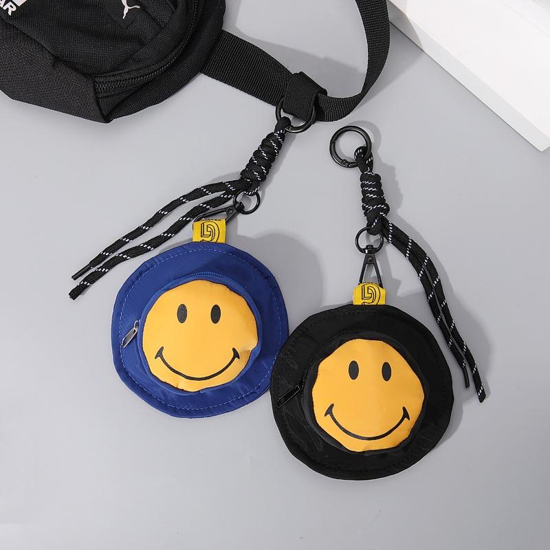 New personalized smiley face mini bucket hat cute earphone bag change bag niche portable creative keychain pendant