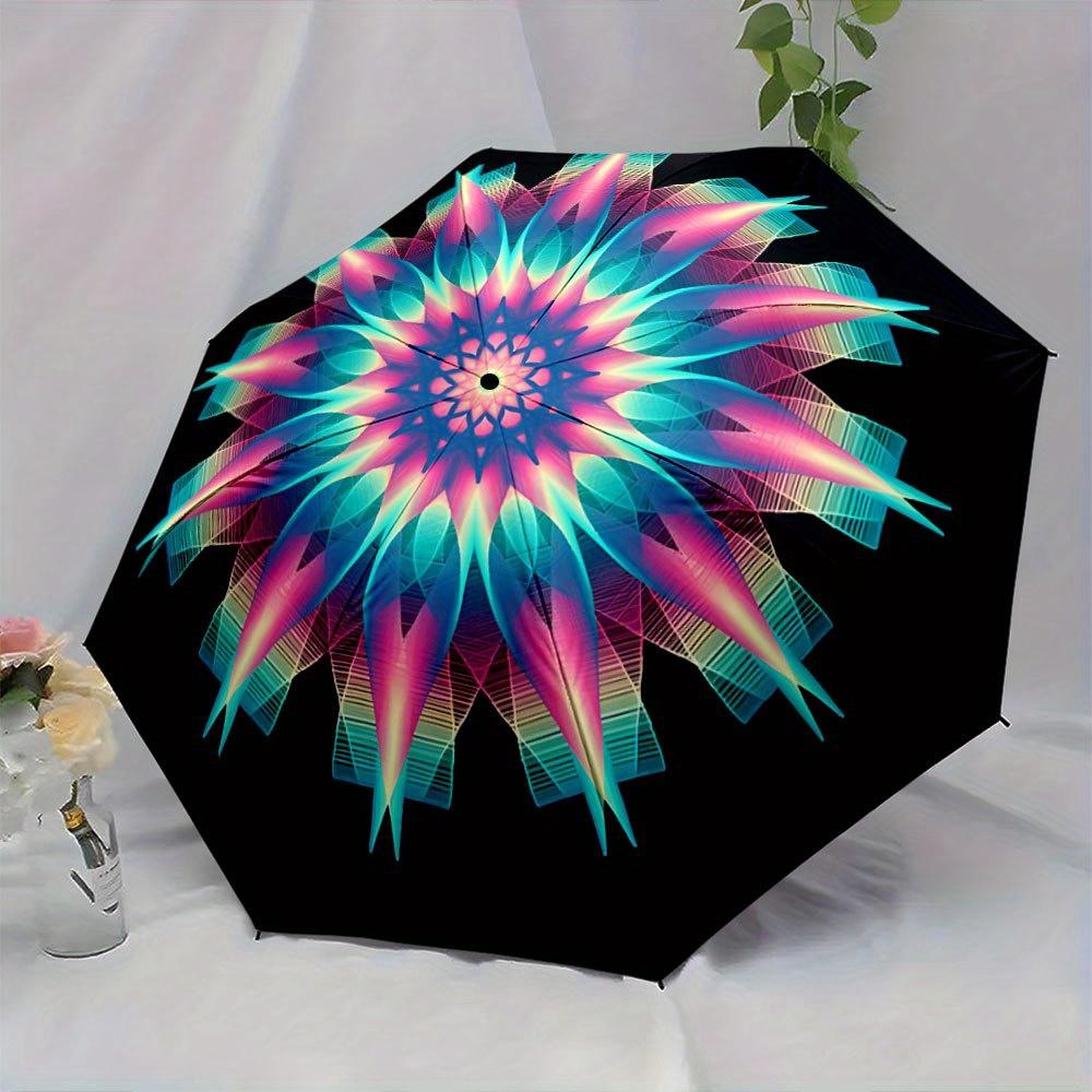 Folding Umbrella The umbrella features a vibrant mandala pattern with neon shades of blue, pink, and yellow with a geometric s