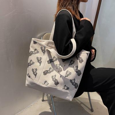 The Same Shoulder Bag, Canvas Bag, Niche Versatile Tote Bag, Large-capacity Student Class KAWS Hand Bag In the Fitting Room