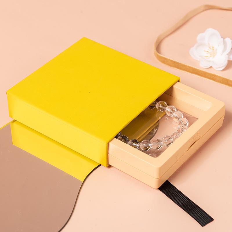 Aufbewahrungsbox für Nagelkunst mit PE-Folie und farbiger Kartenhülle