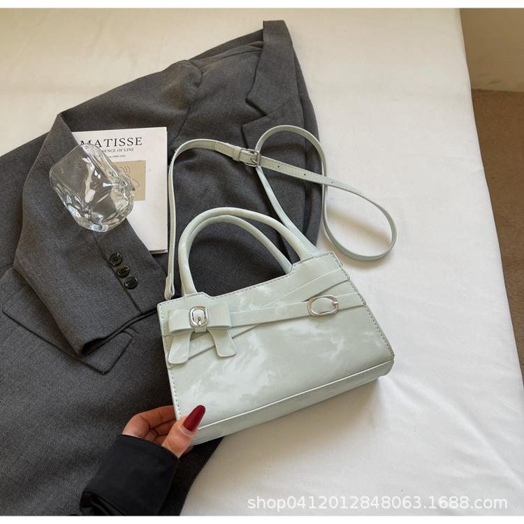 

2025 весна новая высококлассная практичная сумка женская бант модная простая однотонная сумка через плечо сумка-мессенджер