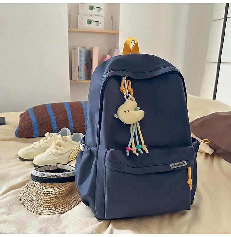 Schoolbag Korean version ins Solid color simple schoolbag Lazy wind backpack Female junior and high school students lightweight large-capacity 