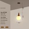 Modern Solid Wood Pendant Lamp with Three Heads, Walnut Finish, Japanese Style for Dining Rooms and Bars.