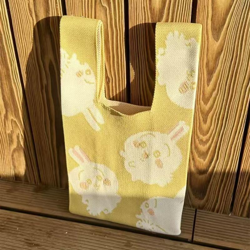 

Cartoon cute Jiyi Xiaoba high-value canvas bag messenger bag popular simple travel bag portable wrist bag