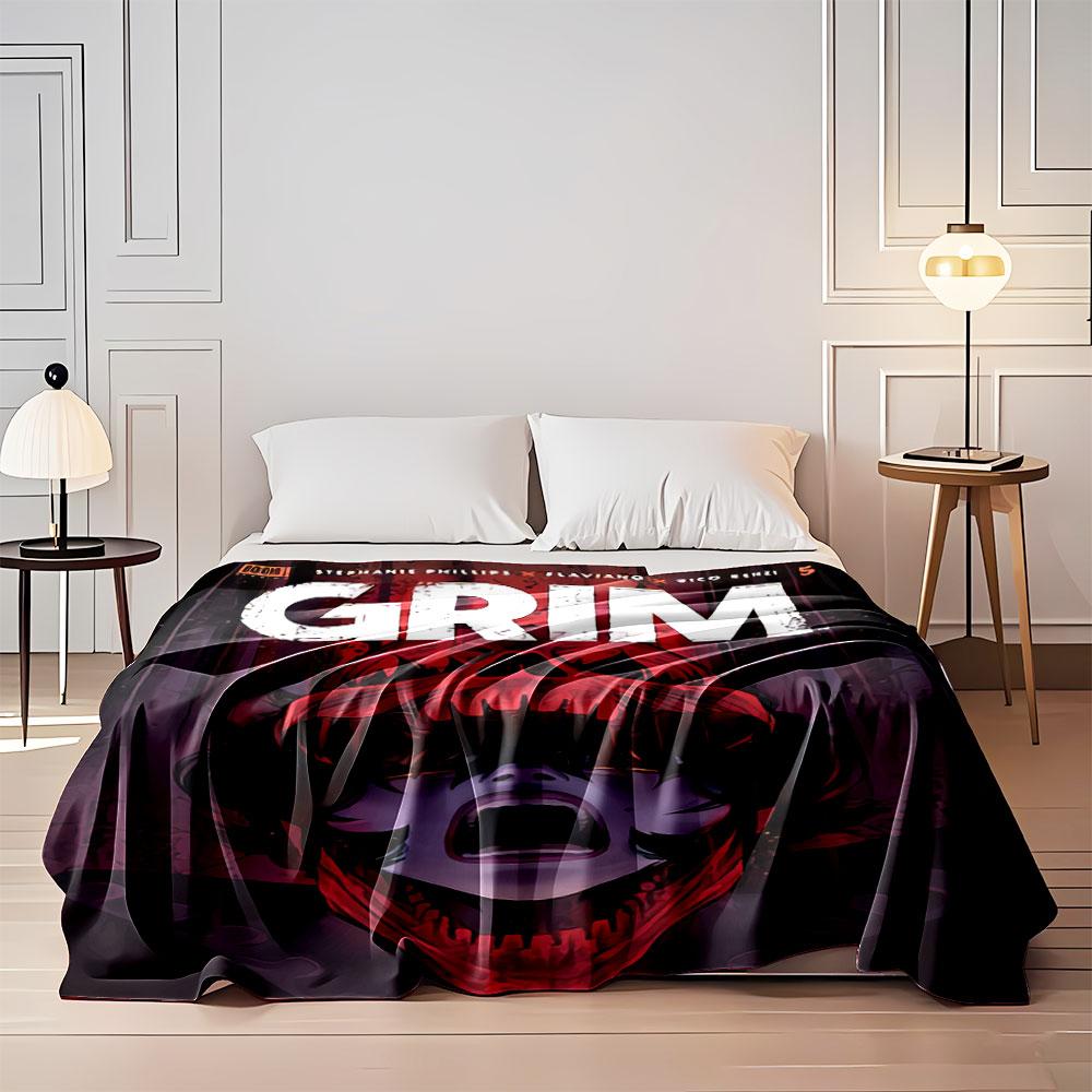 A screaming face framed within a red skull-like shape. for all seasons blanket lunch break throw gift