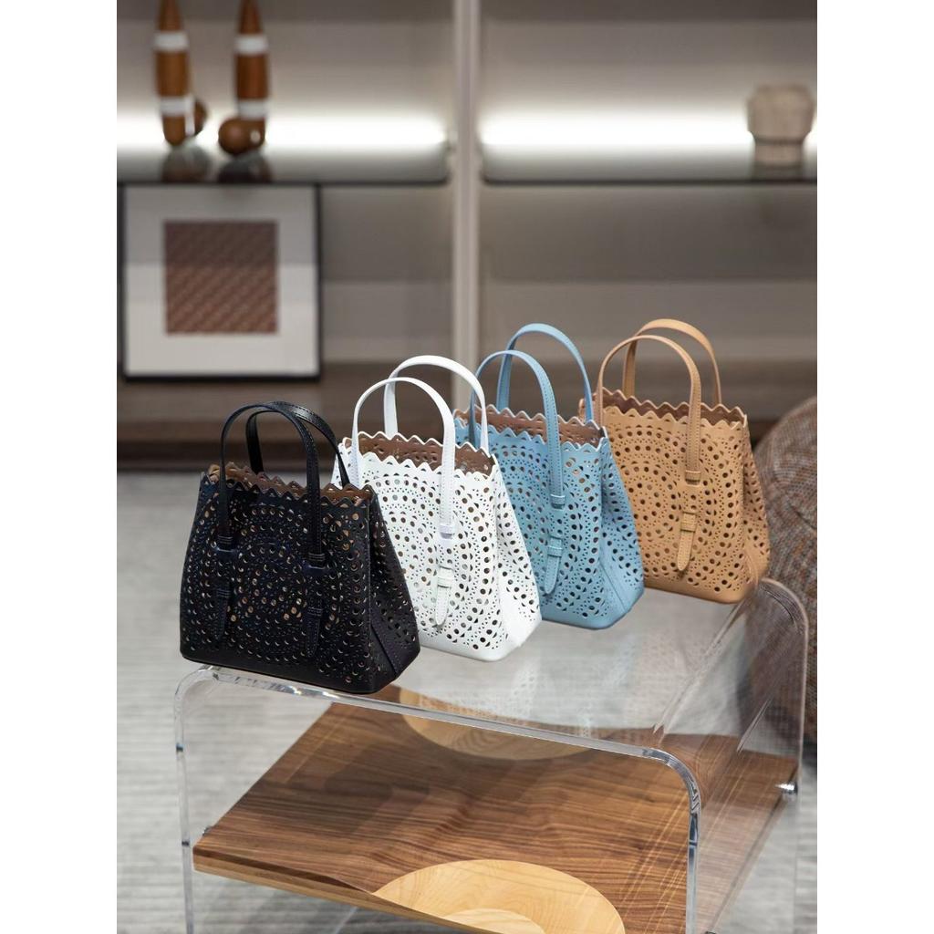 Velkoobchodní továrna prémiová niche vyřezávaná dutá taška na zeleninu Mina kožená dámská taška přes rameno crossbody tote taška