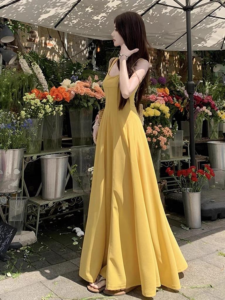New elegant temperament yellow suspender dress children's summer vacation style slim-fitting hip-wrapped dress
