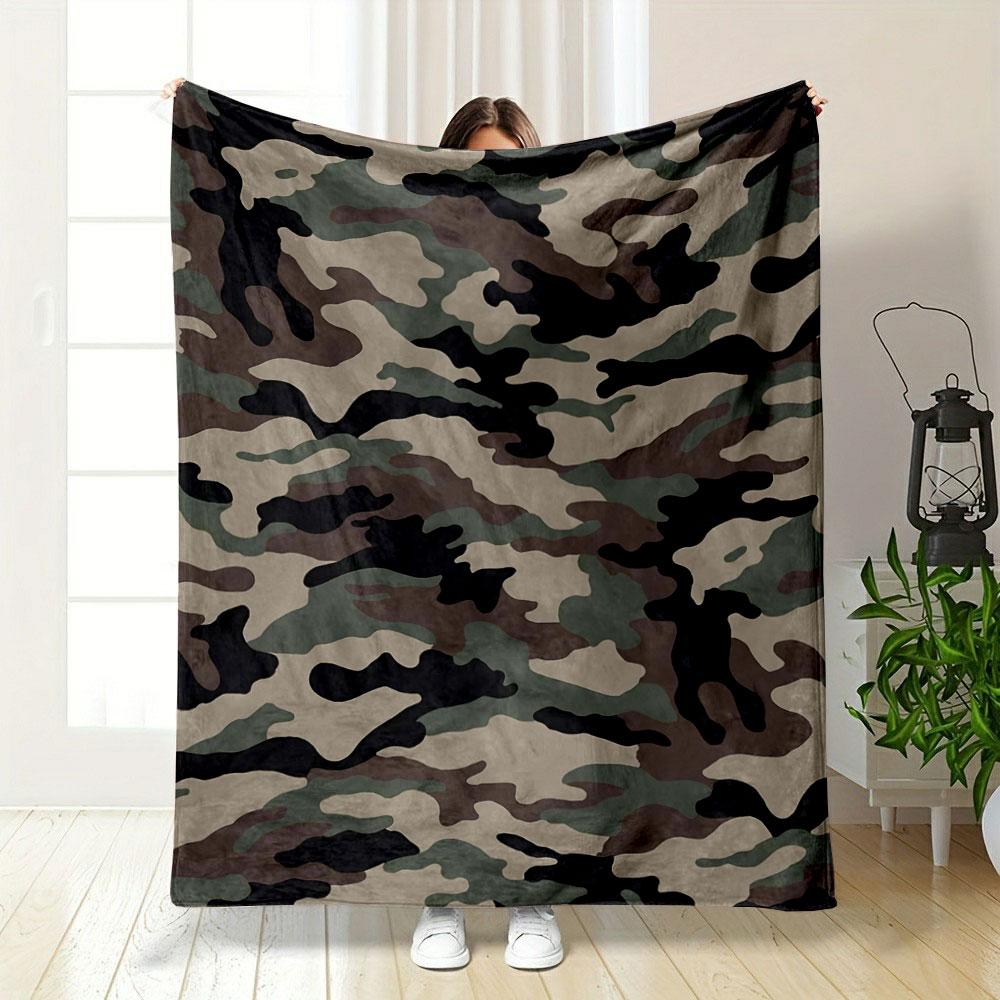 The image features a green, brown, black, and beige camouflage pattern. for all seasons blanket lunch break throw gift