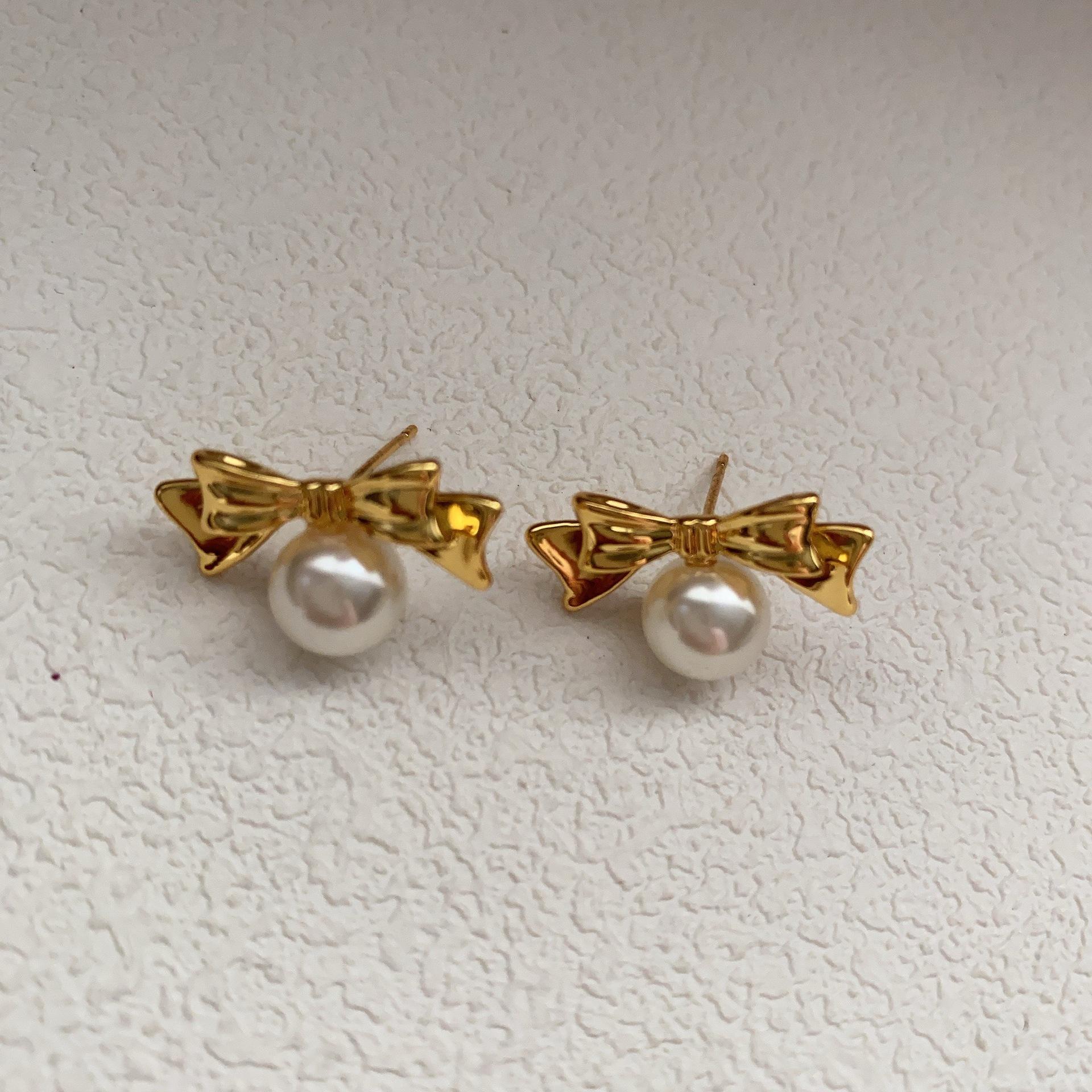 

Золотые серьги-гвоздики с жемчугом и бантом, дизайн, элитный, легкий, роскошный, темперамент, сладкие серьги, красивые серьги