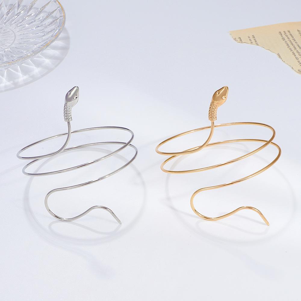 European-American Retro Snake-Shaped Alloy Bangle: Women's Exaggerated Twisted Wrap Animal Bracelet Armlet Cuff.