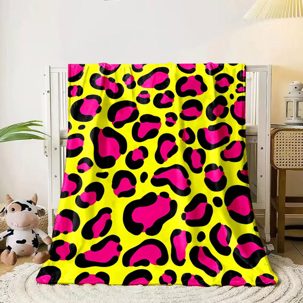 Bright pink leopard-style spots with black outlines on a yellow background. for all seasons blanket lunch break throw gift 80cm x 120cm