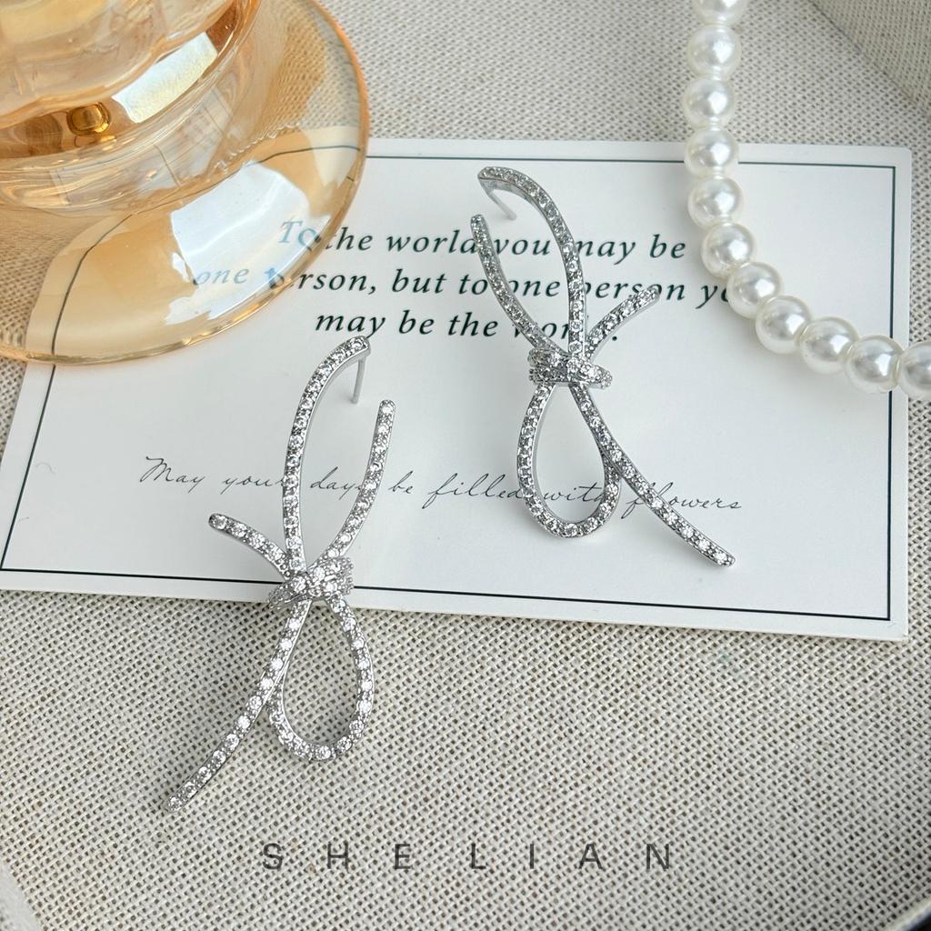 Light luxury exquisite high-end sense ribbon knot temperament earrings niche design sense fashion stud earrings sweet zircon earrings women