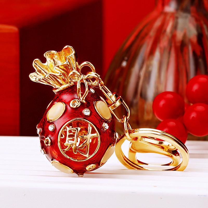 

Металлический брелок изысканный с красочным дизайном мешочка с удачей идеально подходит для подарка Wine Red Bag