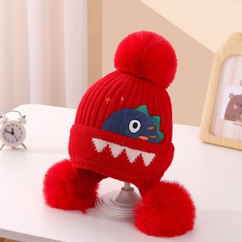 A children's dinosaur wool hat winter new cartoon jacquard knitted hat medium and older boys and girls ear hats
