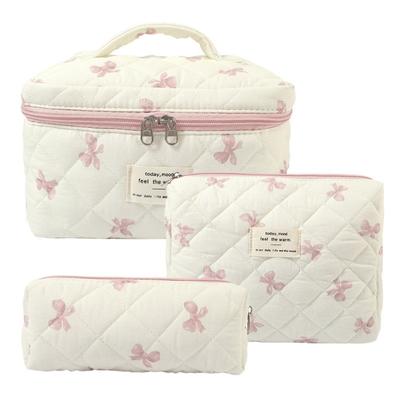 Vente en gros rose nœud papillon matelassé femmes sac cosmétique portable fermeture éclair maquillage organisateur de voyage femme toilette sac à main