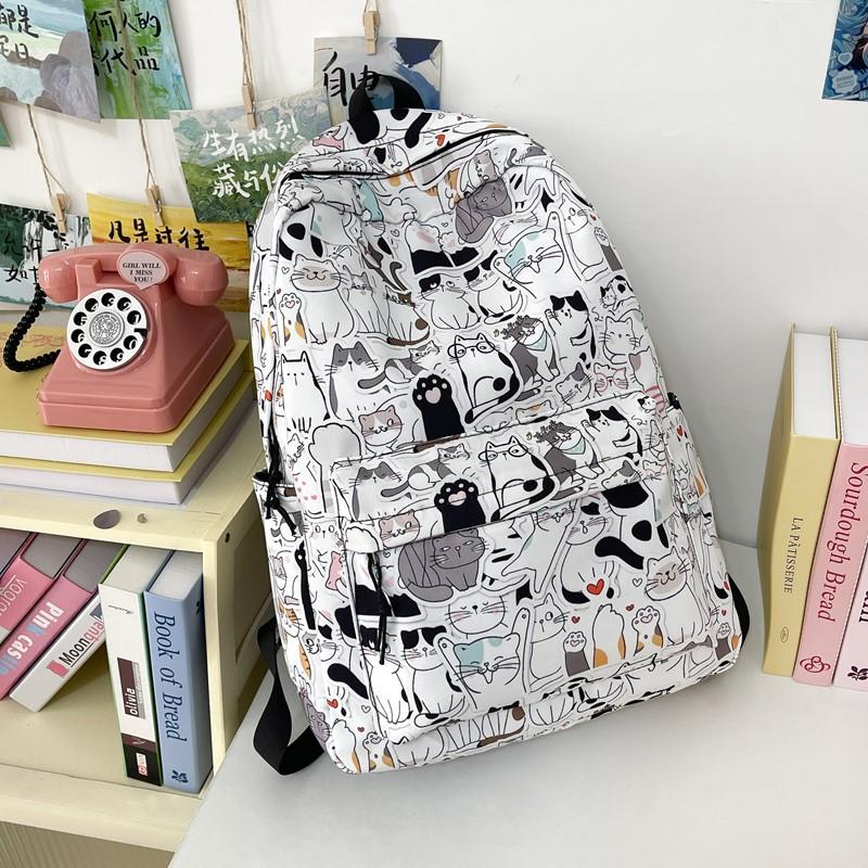 New high-value niche personalized graffiti comics trendy cool backpacks for men and women lightweight large-capacity backpacks