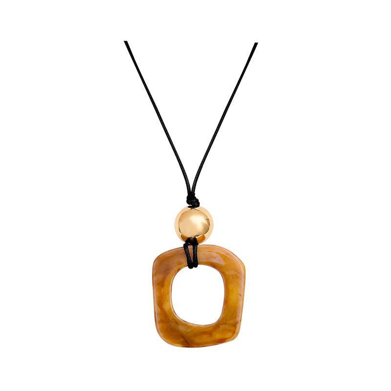 Kaffeefarbene geometrische lange Quasten-Pulloverkette: Ein vielseitiges, stilvolles koreanisches Herbst-/Winter-Accessoire für Damen.