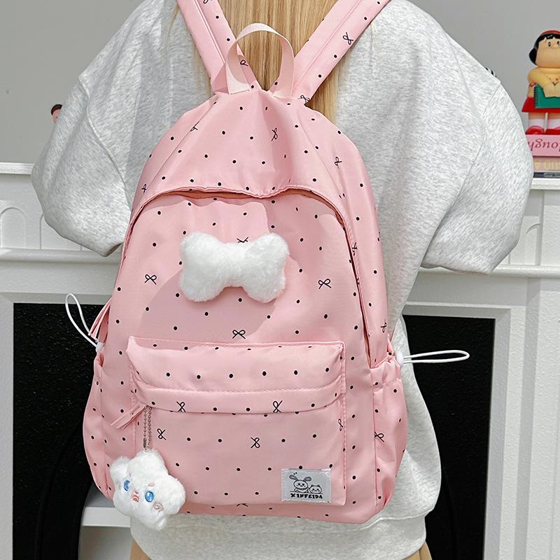 Polka Dot Bow Backpack for Teen Girls: Stylish and Versatile Schoolbag for Middle and High School Students.