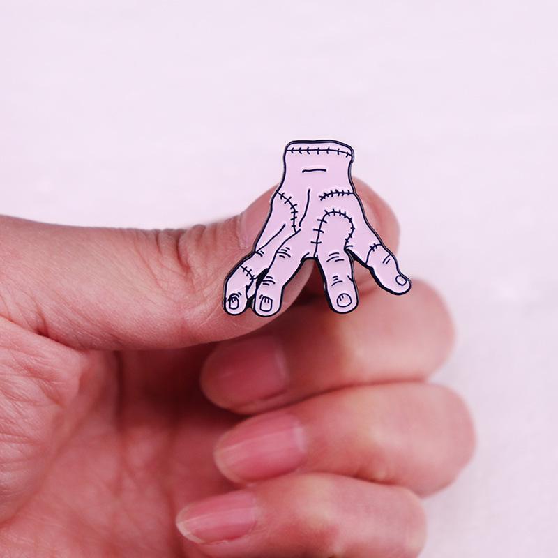 Wednesday Addams Hand Enamel Pin: Horror Anime Metal Badge and Movie Fan Accessory