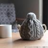 This Smoked Tea Cozy from the Home of Authentic British Tea, Fits 4 Cups (1200ml), Is Made In England from 100% Wool and Cable Knit. The Carefully