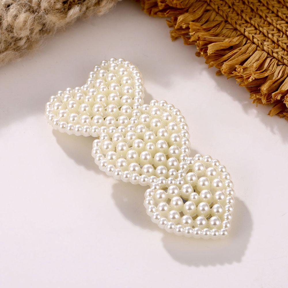 

Набор из 12 заколок для волос с жемчужными бусинами 11