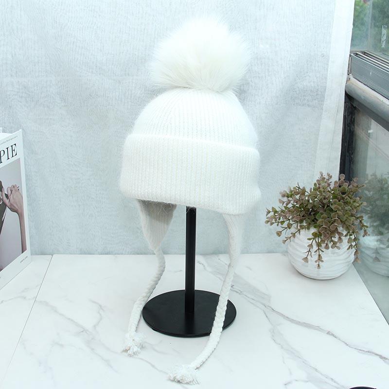 High-quality long rabbit fur ear protectors are exported to Russia in winter, thickened and enlarged, warm fox hairball knitted hat for women