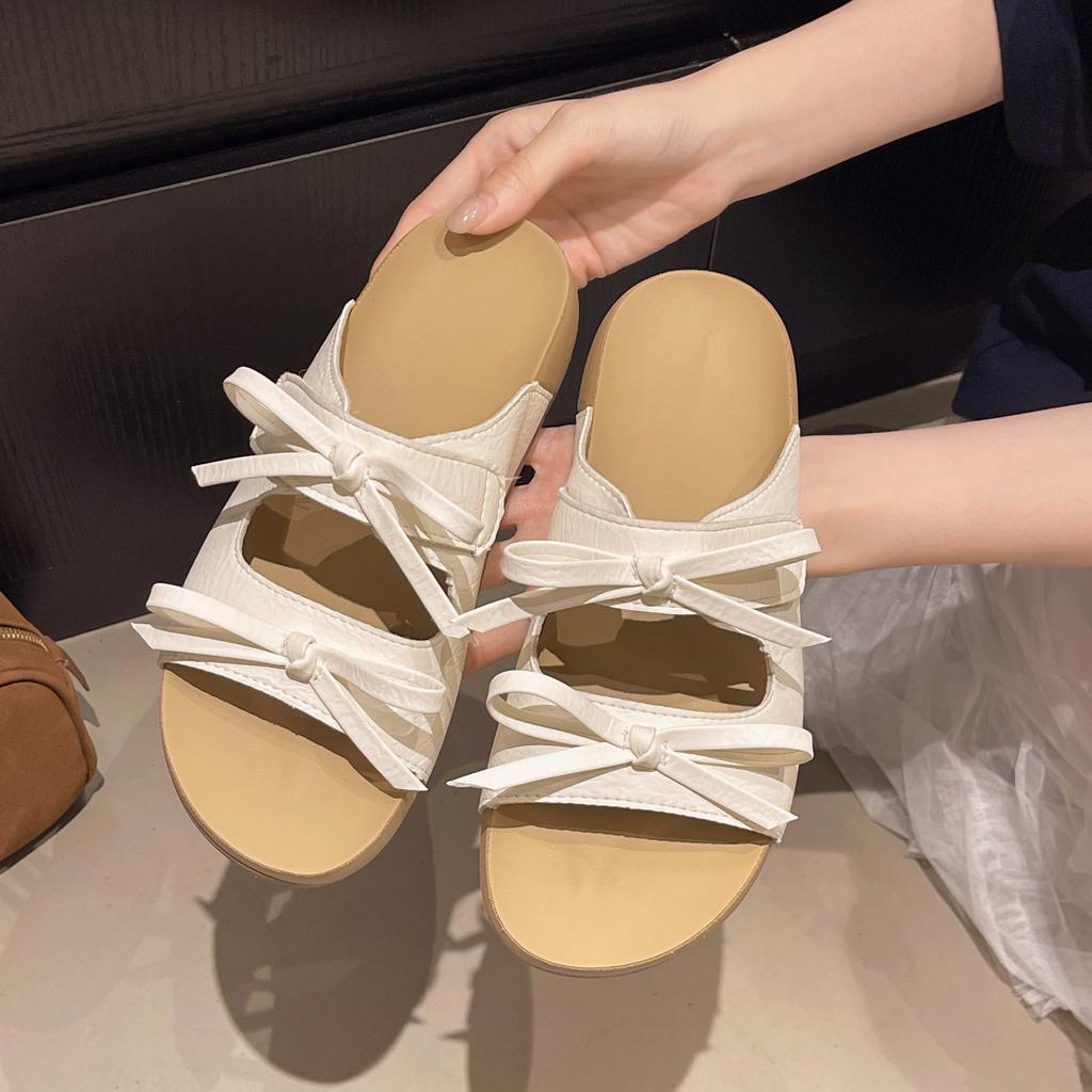 Schleife Flachboden Koreanische Version Ein-Wort-Slipper für Damen Sommerbekleidung 2025 neue Modelle mit Röcken Lässige Strand-Cool-Slipper