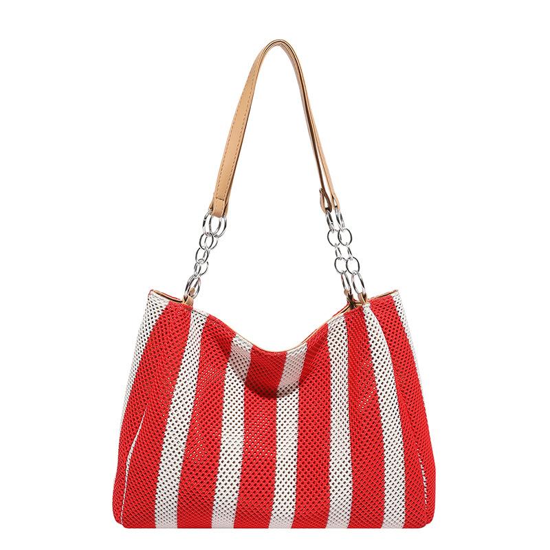 

Fashion contrasting striped woven bag women s new commuter shoulder armpit bag vacation style woven tote bag червоний