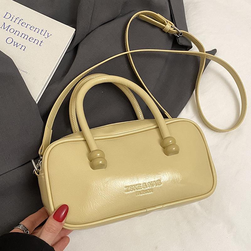 Korean Version of Fashionable Simple Retro Solid Color Portable Boston Bag Casual Versatile Solid Color Commuting Foreign Style Messenger Women's Bag