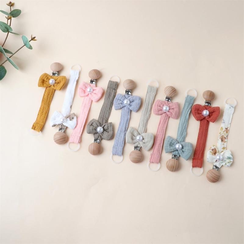 1 Stück Niedlicher Neugeborener Mädchen Schnuller Clip Kette Süße Prinzessin Schleife Schnullerclip Kette Stoff Holz Anti-Verloren Spielzeug Schnullerkette