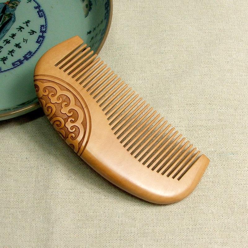 

Ancient Style Double-Sided Carved Peach Wood Comb