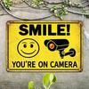 Smile You're On Camera Metal Tin Sign, 2D Flat Humorous Warning Wall Plaque, 12x8 Inch Durable Iron Decor, Easy to Hang