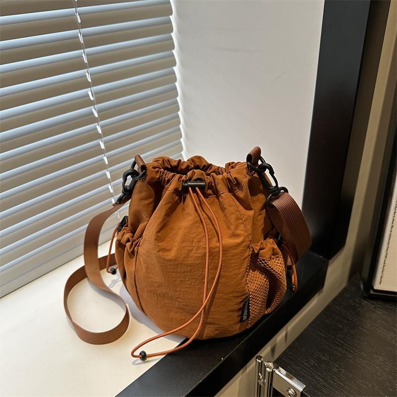 2025 Summer New Japanese and Korean Niche Drawstring Bundle Canvas Shoulder Messenger Bag Women's Light Lazy Wind Bucket Bag