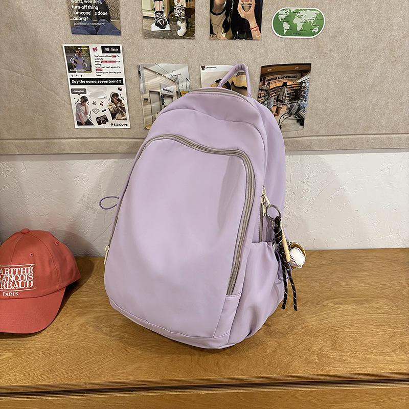 Casual solid color large-capacity schoolbag 2025 new versatile junior high school backpack college student travel backpack tide